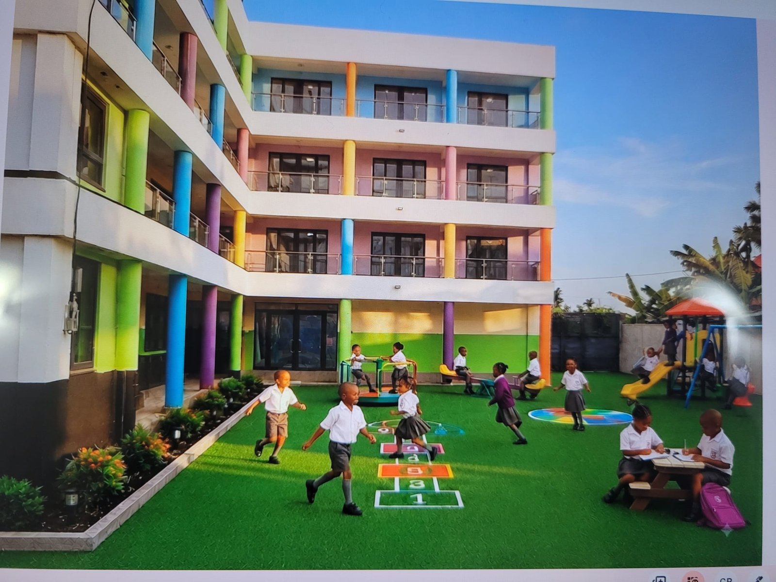 The EBLIS playground, with climbing frame, seesaw and hopscotch court